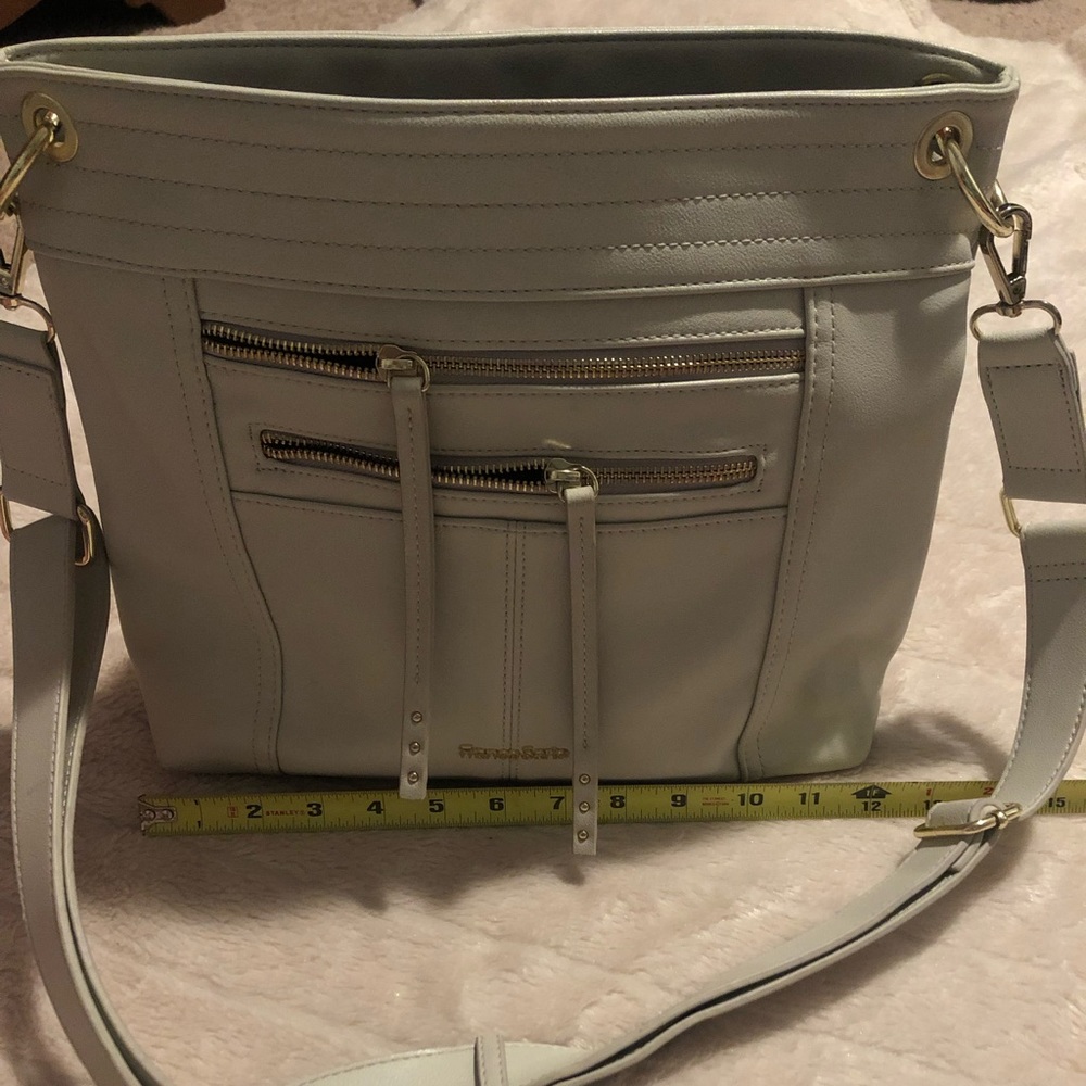 Light beige/cream purse with gold accents.